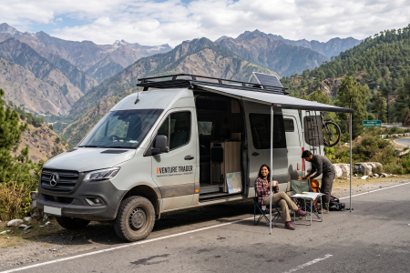 A camper van is parked by the side of the road.